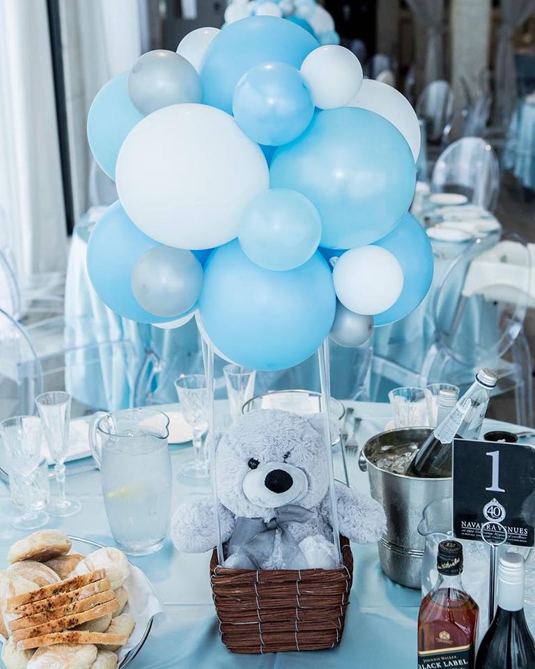 floating teddy bear with balloons